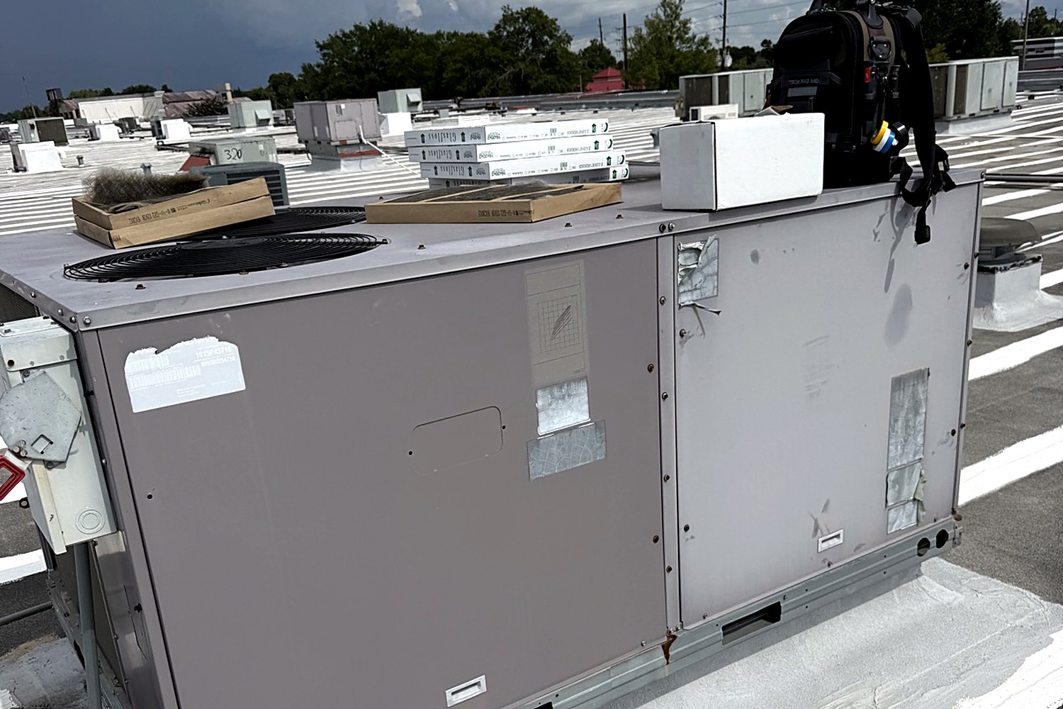 Rooftop packaged unit service with new filters in Houston