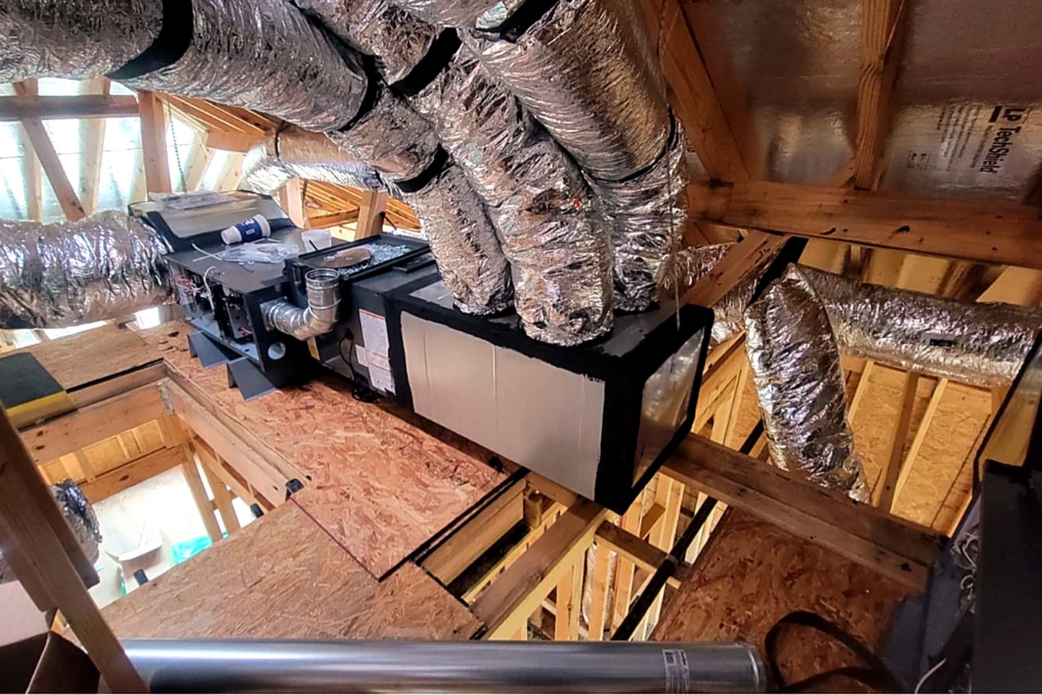Attic HVAC system and ductwork in a Houston home