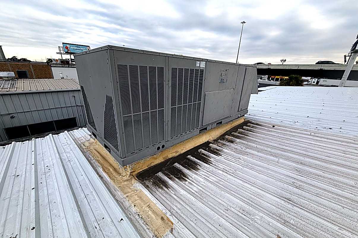 Commercial rooftop unit coil side serviced by Top Texas Choice